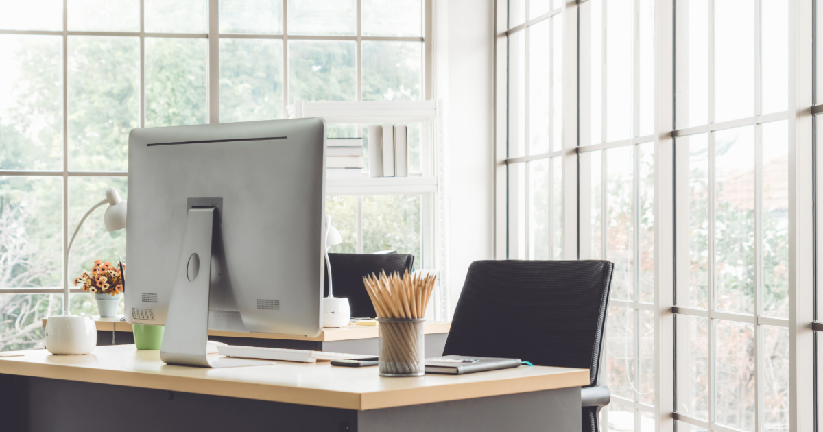 clean small business office space with desk and computer